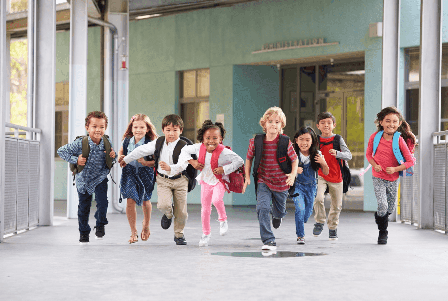 happy school children running in schools in rak